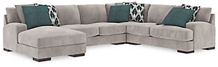 A feast for the eyes and pleasure for the senses, the Bardarson sectional is style and comfort taken to a higher level. Design elements including low track arms and low/wide feet give this sumptuous sectional ultra-contemporary appeal, while deep seats with reversible UltraPlush cushioning and designer feather-filled toss pillows are indulgently comfortable. The plush beige upholstery hits just the right note if you’re looking for a richly neutral sectional that simply goes with everything.Includes 4 pieces: left-arm facing corner chaise, armless loveseat, right-arm facing loveseat and wedge | "Left-arm" and "right-arm" describes the position of the arm when you face the piece | Corner-blocked frame | Loose back and seat cushions | Reversible UltraPlush cushions remain loftier longer | 2 layers of cushioned comfort: high-density foam core encased in thick polyfill | 6 accent pillows included | Pillows with feather inserts and hidden zippers | Polyester/polyurethane upholstery; polyester and polyester/polyurethane pillows | Exposed feet with faux wood finish | Estimated Assembly Time: 15 Minutes