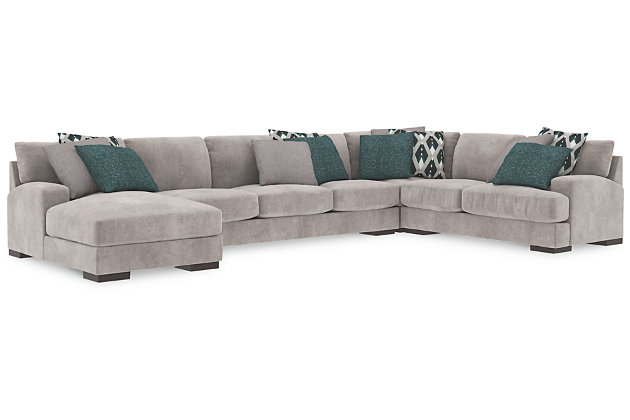 A feast for the eyes and pleasure for the senses, the Bardarson sectional is style and comfort taken to a higher level. Design elements including low track arms and low/wide feet give this sumptuous sectional ultra-contemporary appeal, while deep seats with reversible UltraPlush cushioning and designer feather-filled toss pillows are indulgently comfortable. The plush beige upholstery hits just the right note if you’re looking for a richly neutral sectional that simply goes with everything.Includes 4 pieces: left-arm facing corner chaise, right-arm facing loveseat, armless sofa and wedge  | Left-arm and "right-arm" describes the position of the arm when you face the piece | Corner-blocked frame | Loose back and seat cushions | Reversible UltraPlush cushions remain loftier longer | 2 layers of cushioned comfort: high-density foam core encased in thick polyfill | 9 accent pillows included | Pillows with feather inserts and hidden zippers | Polyester/polyurethane upholstery; polyester and polyester/polyurethane pillows | Exposed feet with faux wood finish | Estimated Assembly Time: 15 Minutes