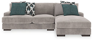 A feast for the eyes and pleasure for the senses, the Bardarson sectional is style and comfort taken to a higher level. Design elements including low track arms and low/wide feet give this sumptuous sectional ultra-contemporary appeal, while deep seats with reversible UltraPlush cushioning and designer feather-filled toss pillows are indulgently comfortable. The plush beige upholstery hits just the right note if you’re looking for a richly neutral sectional that simply goes with everything.Includes 2 pieces: right-arm facing corner chaise and left-arm facing loveseat | "Left-arm" and "right-arm" describes the position of the arm when you face the piece | Corner-blocked frame | Loose back and seat cushions | Reversible UltraPlush cushions remain loftier longer | 2 layers of cushioned comfort: high-density foam core encased in thick polyfill | 6 accent pillows included | Pillows with feather inserts and hidden zippers | Polyester/polyurethane upholstery; polyester and polyester/polyurethane pillows | Exposed feet with faux wood finish | Estimated Assembly Time: 5 Minutes