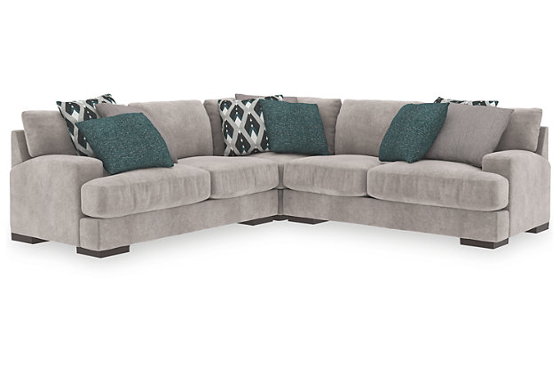 A feast for the eyes and pleasure for the senses, the Bardarson sectional is style and comfort taken to a higher level. Design elements including low track arms and low/wide feet give this sumptuous sectional ultra-contemporary appeal, while deep seats with reversible UltraPlush cushioning and designer feather-filled toss pillows are indulgently comfortable. The plush beige upholstery hits just the right note if you’re looking for a richly neutral sectional that simply goes with everything.Includes 3 pieces: left-arm facing loveseat, right-arm facing loveseat and wedge | "Left-arm" and "right-arm" describes the position of the arm when you face the piece | Corner-blocked frame | Loose back and seat cushions | Reversible UltraPlush cushions remain loftier longer | 2 layers of cushioned comfort: high-density foam core encased in thick polyfill | 6 accent pillows included | Pillows with feather inserts and hidden zippers | Polyester/polyurethane upholstery; polyester and polyester/polyurethane pillows | Exposed feet with faux wood finish | Estimated Assembly Time: 10 Minutes