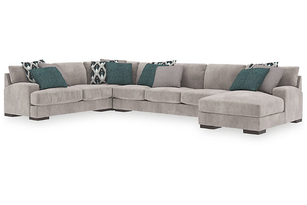 A feast for the eyes and pleasure for the senses, the Bardarson sectional is style and comfort taken to a higher level. Design elements including low track arms and low/wide feet give this sumptuous sectional ultra-contemporary appeal, while deep seats with reversible UltraPlush cushioning and designer feather-filled toss pillows are indulgently comfortable. The plush beige upholstery hits just the right note if you’re looking for a richly neutral sectional that simply goes with everything.Includes 4 pieces: right-arm facing corner chaise, left-arm facing loveseat, armless sofa and wedge | "Left-arm" and "right-arm" describes the position of the arm when you face the piece | Corner-blocked frame | Loose back and seat cushions | Reversible UltraPlush cushions remain loftier longer | 2 layers of cushioned comfort: high-density foam core encased in thick polyfill | 9 accent pillows included | Pillows with feather inserts and hidden zippers | Polyester/polyurethane upholstery; polyester and polyester/polyurethane pillows | Exposed feet with faux wood finish | Estimated Assembly Time: 15 Minutes