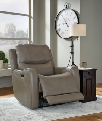 The Galahad power recliner might look crisp, clean and lean, but it’s packed with technologically advanced features that truly elevate the art of relaxation. Its zero-gravity mechanism lifts the ottoman four inches higher than traditional recliners (23" off the floor) for better blood flow from your legs to your heart. With the touch of a button, let the stress of the day float away care of an air massage system (with three pampering settings)—or get warm and toasty thanks to a heated seat element. While ultra streamlined, this designer recliner doesn’t cut corners when it comes to quality. The seating area and armrests are upholstered in genuine leather for incomparable comfort—where it counts. Crosshatch stitching adds fashion-forward flair.One-touch power control with adjustable positions, Easy View™ adjustable headrest and zero-draw USB plug-in | Zero-draw technology only consumes power when the USB receptacle is in use | Air massage system includes 3 settings: steady, pulse and wave (with automatic 20-minute shutoff feature) | Heat in the seat element (with automatic 30-minute shutoff feature) | Corner-blocked frame with metal reinforced seat | Attached back and seat cushions | High-resiliency foam cushions wrapped in thick poly fiber | Zero-gravity mechanism (raises the ottoman to 23" off the floor for improved blood flow) | Extended ottoman for enhanced comfort | Leather interior upholstery; vinyl/polyester exterior upholstery | Power cord included; UL Listed | Estimated Assembly Time: 15 Minutes