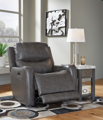 The Galahad power recliner might look crisp, clean and lean, but it’s packed with technologically advanced features that truly elevate the art of relaxation. Its zero-gravity mechanism lifts the ottoman four inches higher than traditional recliners (23" off the floor) for better blood flow from your legs to your heart. With the touch of a button, let the stress of the day float away care of an air massage system (with three pampering settings)—or get warm and toasty thanks to a heated seat element. While ultra streamlined, this designer recliner doesn’t cut corners when it comes to quality. The seating area and armrests are upholstered in genuine leather for incomparable comfort—where it counts. Crosshatch stitching adds fashion-forward flair.One-touch power control with adjustable positions, Easy View™ adjustable headrest and zero-draw USB plug-in | Zero-draw technology only consumes power when the USB receptacle is in use | Air massage system includes 3 settings: steady, pulse and wave (with automatic 20-minute shutoff feature) | Heat in the seat element (with automatic 30-minute shutoff feature) | Corner-blocked frame with metal reinforced seat | Attached back and seat cushions | High-resiliency foam cushions wrapped in thick poly fiber | Zero-gravity mechanism (raises the ottoman to 23" off the floor for improved blood flow) | Extended ottoman for enhanced comfort | Leather interior upholstery; vinyl/polyester exterior upholstery | Power cord included; UL Listed | Estimated Assembly Time: 15 Minutes