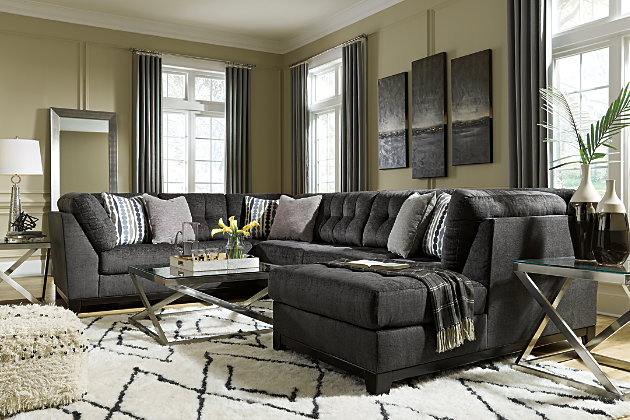 Stealing the show in a steel gray upholstery that's wonderfully plush and so on trend, the Reidshire sectional takes center stage when it comes to comfort and contemporary style. Details including subtle grid tufting and an exposed rail design give this richly tailored sectional standout character. Complementary toss pillows enhance the experience.Includes 3 pieces: right-arm facing corner chaise, armless loveseat and left-arm facing sofa | "Left-arm" and "right-arm" describe the position of the arm when you face the piece | Corner-blocked frame; exposed rail and feet with faux wood finish | Attached back and loose seat cushions | High-resiliency foam cushions wrapped in thick poly fiber | Toss pillows included; soft polyfill | Polyester upholstery and pillows | Estimated Assembly Time: 10 Minutes