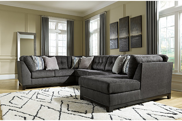 Stealing the show in a steel gray upholstery that's wonderfully plush and so on trend, the Reidshire sectional takes center stage when it comes to comfort and contemporary style. Details including subtle grid tufting and an exposed rail design give this richly tailored sectional standout character. Complementary toss pillows enhance the experience.Includes 3 pieces: right-arm facing corner chaise, armless loveseat and left-arm facing sofa | "Left-arm" and "right-arm" describe the position of the arm when you face the piece | Corner-blocked frame; exposed rail and feet with faux wood finish | Attached back and loose seat cushions | High-resiliency foam cushions wrapped in thick poly fiber | Toss pillows included; soft polyfill | Polyester upholstery and pillows | Estimated Assembly Time: 10 Minutes