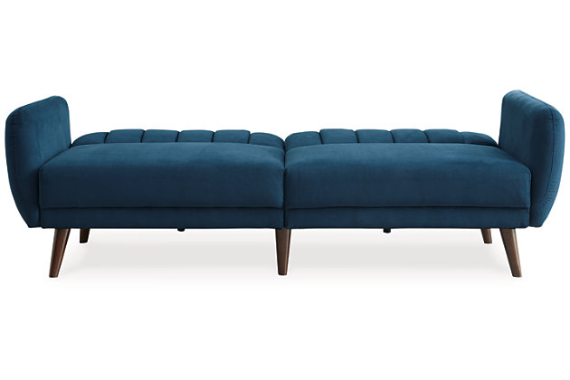 Make room for high style—and the occasional overnight guest—with help from the Mesilla flip flop sofa in marine blue. This ultra-contemporary sofa-futon is the ultimate choice if you’re short on space. Tailored touches including canted wood-tone legs and back cushions with vertical channel stitching lend an upscale sensibility.Attached back and seat cushions | High-resiliency foam cushions wrapped in thick poly fiber | Polyester upholstery | Tufted details | 2 USB ports; power cord included; UL Listed | Exposed wood-tone legs | Estimated Assembly Time: 15 Minutes