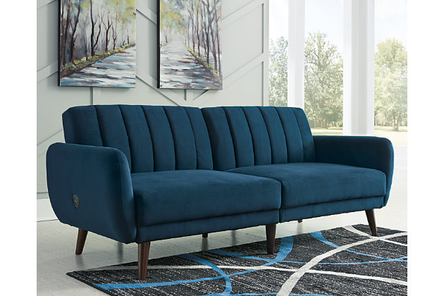Make room for high style—and the occasional overnight guest—with help from the Mesilla flip flop sofa in marine blue. This ultra-contemporary sofa-futon is the ultimate choice if you’re short on space. Tailored touches including canted wood-tone legs and back cushions with vertical channel stitching lend an upscale sensibility.Attached back and seat cushions | High-resiliency foam cushions wrapped in thick poly fiber | Polyester upholstery | Tufted details | 2 USB ports; power cord included; UL Listed | Exposed wood-tone legs | Estimated Assembly Time: 15 Minutes