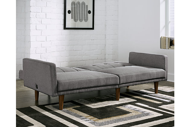 Love furniture with a mid-century modern twist? Then you’re sure to flip for the gorgeous Gaddis flip flop sofa in gray. This brilliantly styled sofa-futon is the ultimate choice if you’re short on space but long for form and function. Tailored touches including tapered wood-tone legs and tufted box cushions exude an upscale mood reflecting your fine taste.Attached back and seat cushions | High-resiliency foam cushions wrapped in thick poly fiber | Polyester upholstery | Tufted details | 2 USB ports; power cord included; UL Listed | Exposed wood-tone legs | Estimated Assembly Time: 30 Minutes