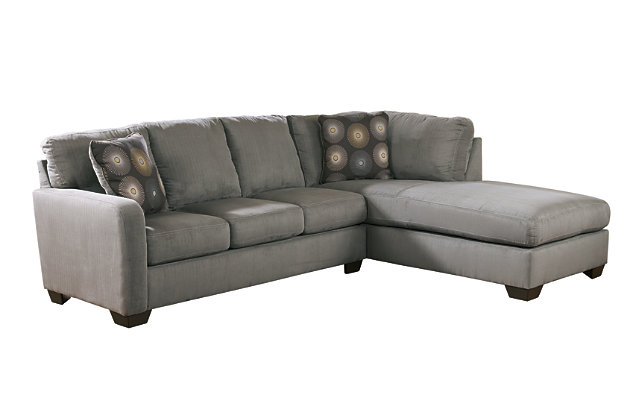 The Zella sectional beautifully pairs your love for kick-back comfort and your appreciation for clean, contemporary design. Back cushions are structured yet plush, while chaise brings neat dimension and a cool lounging place into your space.Includes 2 pieces: right-arm facing chaise and left-arm facing sofa | Corner-blocked frame | Tight back and loose seat cushions | High-resiliency foam cushions wrapped in thick poly fiber | 2 decorative pillows included | Pillows with soft polyfill | Polyester upholstery; polyester and rayon/polyester pillows | Exposed legs with faux wood finish | “Left-arm” and right-arm” describes the position of the arm when you face the piece | Estimated Assembly Time: 5 Minutes