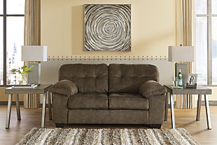 Looking for the perfect blend of decadent comfort and contemporary flair? Feast your eyes on the sensational Accrington sofa and loveseat set. Tufted box cushioning and thick pillow top armrests brilliantly merge style and a sumptuous feel. Wonderfully plush to the touch, the earthy brown fabric is the ultimate choice for a chic, trendy look.Corner-blocked frame | Attached back and loose seat cushions | High-resiliency foam cushions wrapped in thick poly fiber | Polyester upholstery | Platform foundation system resists sagging 3x better than spring system after 20,000 testing cycles by providing more even support | Smooth platform foundation maintains tight, wrinkle-free look without dips or sags that can occur over time with sinuous spring foundations | Exposed feet with faux wood finish