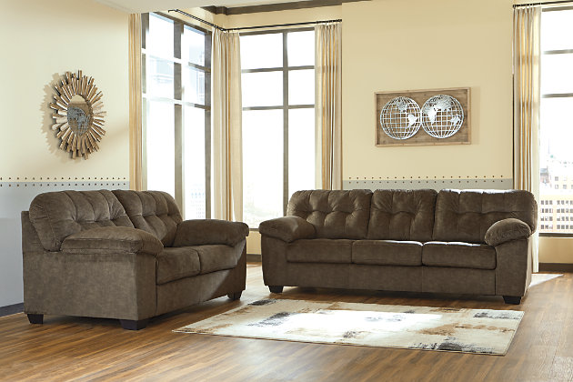 Looking for the perfect blend of decadent comfort and contemporary flair? Feast your eyes on the Accrington sofa. Tufted box cushioning and thick pillow top armrests brilliantly merge style and a sumptuous feel. Wonderfully plush to the touch, the sofa’s earthy brown fabric is the ultimate choice for a richly neutral look.Corner-blocked frame | Attached back and loose seat cushions | High-resiliency foam cushions wrapped in thick poly fiber | Platform foundation system resists sagging 3x better than spring system after 20,000 testing cycles by providing more even support | Smooth platform foundation maintains tight, wrinkle-free look without dips or sags that can occur over time with sinuous spring foundations | Polyester upholstery | Exposed feet with faux wood finish