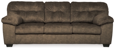 Looking for the perfect blend of decadent comfort and contemporary flair? Feast your eyes on the Accrington sofa. Tufted box cushioning and thick pillow top armrests brilliantly merge style and a sumptuous feel. Wonderfully plush to the touch, the sofa’s earthy brown fabric is the ultimate choice for a richly neutral look.Corner-blocked frame | Attached back and loose seat cushions | High-resiliency foam cushions wrapped in thick poly fiber | Platform foundation system resists sagging 3x better than spring system after 20,000 testing cycles by providing more even support | Smooth platform foundation maintains tight, wrinkle-free look without dips or sags that can occur over time with sinuous spring foundations | Polyester upholstery | Exposed feet with faux wood finish