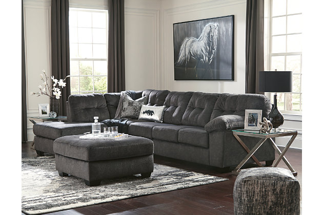 Looking for the perfect blend of decadent comfort and contemporary flair? Feast your eyes on the Accrington sectional. Tufted box cushioning and thick pillow top armrests brilliantly merge style and a sumptuous feel. Wonderfully plush to the touch, the sectional’s granite gray fabric is the ultimate choice for a chic, trendy look.Includes 2 pieces: left-arm facing corner chaise and right-arm facing sofa | "Left-arm" and "right-arm" describe the position of the arm when you face the piece | Corner-blocked frame | Attached back and loose seat cushions | High-resiliency foam cushions wrapped in thick poly fiber | Polyester upholstery | Exposed feet with faux wood finish | Estimated Assembly Time: 5 Minutes