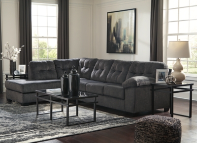 Looking for the perfect blend of decadent comfort and contemporary flair? Feast your eyes on the Accrington sectional. Tufted box cushioning and thick pillow top armrests brilliantly merge style and a sumptuous feel. Wonderfully plush to the touch, the sectional’s granite gray fabric is the ultimate choice for a chic, trendy look.Includes 2 pieces: left-arm facing corner chaise and right-arm facing sofa | "Left-arm" and "right-arm" describe the position of the arm when you face the piece | Corner-blocked frame | Attached back and loose seat cushions | High-resiliency foam cushions wrapped in thick poly fiber | Polyester upholstery | Exposed feet with faux wood finish | Estimated Assembly Time: 5 Minutes