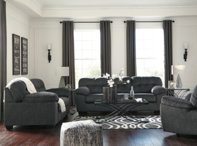 Looking for the perfect blend of decadent comfort and contemporary flair? Feast your eyes on the Accrington sofa. Tufted box cushioning and thick pillow top armrests brilliantly merge style and a sumptuous feel. Wonderfully plush to the touch, the sofa's granite gray fabric is the ultimate choice for a chic, trendy look.Corner-blocked frame | Attached back and loose seat cushions | High-resiliency foam cushions wrapped in thick poly fiber | Platform foundation system resists sagging 3x better than spring system after 20,000 testing cycles by providing more even support | Smooth platform foundation maintains tight, wrinkle-free look without dips or sags that can occur over time with sinuous spring foundations | Polyester upholstery | Exposed feet with faux wood finish