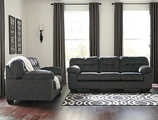 Looking for the perfect blend of decadent comfort and contemporary flair? Feast your eyes on the Accrington sofa. Tufted box cushioning and thick pillow top armrests brilliantly merge style and a sumptuous feel. Wonderfully plush to the touch, the sofa's granite gray fabric is the ultimate choice for a chic, trendy look.Corner-blocked frame | Attached back and loose seat cushions | High-resiliency foam cushions wrapped in thick poly fiber | Platform foundation system resists sagging 3x better than spring system after 20,000 testing cycles by providing more even support | Smooth platform foundation maintains tight, wrinkle-free look without dips or sags that can occur over time with sinuous spring foundations | Polyester upholstery | Exposed feet with faux wood finish