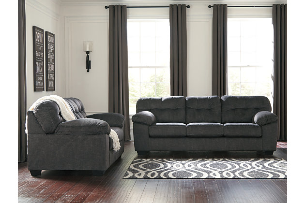 Looking for the perfect blend of decadent comfort and contemporary flair? Feast your eyes on the Accrington sofa. Tufted box cushioning and thick pillow top armrests brilliantly merge style and a sumptuous feel. Wonderfully plush to the touch, the sofa's granite gray fabric is the ultimate choice for a chic, trendy look.Corner-blocked frame | Attached back and loose seat cushions | High-resiliency foam cushions wrapped in thick poly fiber | Platform foundation system resists sagging 3x better than spring system after 20,000 testing cycles by providing more even support | Smooth platform foundation maintains tight, wrinkle-free look without dips or sags that can occur over time with sinuous spring foundations | Polyester upholstery | Exposed feet with faux wood finish