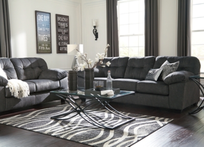 Looking for the perfect blend of decadent comfort and contemporary flair? Feast your eyes on the Accrington sofa. Tufted box cushioning and thick pillow top armrests brilliantly merge style and a sumptuous feel. Wonderfully plush to the touch, the sofa's granite gray fabric is the ultimate choice for a chic, trendy look.Corner-blocked frame | Attached back and loose seat cushions | High-resiliency foam cushions wrapped in thick poly fiber | Platform foundation system resists sagging 3x better than spring system after 20,000 testing cycles by providing more even support | Smooth platform foundation maintains tight, wrinkle-free look without dips or sags that can occur over time with sinuous spring foundations | Polyester upholstery | Exposed feet with faux wood finish