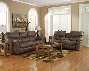 Crafted to fit like a glove and cradle you in comfort, the Alzena reclining loveseat with console is just the right blend of tough and tender—offering the look of weathered leather you treasure, with the luxurious feel of supple suede that never gets old. Stylish details such as jumbo stitching—along with a split back for extra lumbar support and double-stuffed armrests—complete this fine faux leather piece.Pull tab reclining motion | Corner-blocked frame with metal reinforced seat | Attached back and seat cushions | High-resiliency foam cushions wrapped in thick poly fiber | Polyester/polyurethane upholstery | Lift-top storage console and 2 cup holders