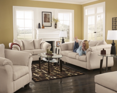 Talk about fine lines and great curves. That’s the beauty of the Darcy sofa—made to suit your appreciation for clean, contemporary style. A striking flared frame, comfy pillow top armrests and an ultra-soft upholstery that holds up to everyday living complete this fashion statement.High-resiliency foam cushions wrapped in thick poly fiber | Polyester upholstery | Loose seat and attached back and armrest cushions | Exposed feet with faux wood finish | Corner-blocked frame | Excluded from promotional discounts and coupons