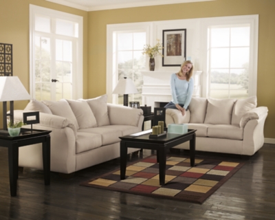 Talk about fine lines and great curves. That’s the beauty of the Darcy sofa—made to suit your appreciation for clean, contemporary style. A striking flared frame, comfy pillow top armrests and an ultra-soft upholstery that holds up to everyday living complete this fashion statement.High-resiliency foam cushions wrapped in thick poly fiber | Polyester upholstery | Loose seat and attached back and armrest cushions | Exposed feet with faux wood finish | Corner-blocked frame | Excluded from promotional discounts and coupons