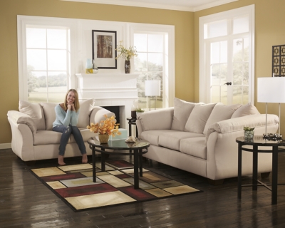 Talk about fine lines and great curves. That’s the beauty of the Darcy sofa—made to suit your appreciation for clean, contemporary style. A striking flared frame, comfy pillow top armrests and an ultra-soft upholstery that holds up to everyday living complete this fashion statement.High-resiliency foam cushions wrapped in thick poly fiber | Polyester upholstery | Loose seat and attached back and armrest cushions | Exposed feet with faux wood finish | Corner-blocked frame | Excluded from promotional discounts and coupons
