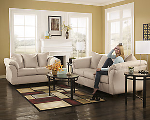 Talk about fine lines and great curves. That’s the beauty of the Darcy sofa—made to suit your appreciation for clean, contemporary style. A striking flared frame, comfy pillow top armrests and an ultra-soft upholstery that holds up to everyday living complete this fashion statement.High-resiliency foam cushions wrapped in thick poly fiber | Polyester upholstery | Loose seat and attached back and armrest cushions | Exposed feet with faux wood finish | Corner-blocked frame | Excluded from promotional discounts and coupons