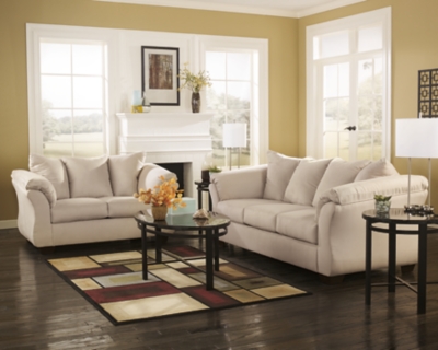 Talk about fine lines and great curves. That’s the beauty of the Darcy sofa—made to suit your appreciation for clean, contemporary style. A striking flared frame, comfy pillow top armrests and an ultra-soft upholstery that holds up to everyday living complete this fashion statement.High-resiliency foam cushions wrapped in thick poly fiber | Polyester upholstery | Loose seat and attached back and armrest cushions | Exposed feet with faux wood finish | Corner-blocked frame | Excluded from promotional discounts and coupons