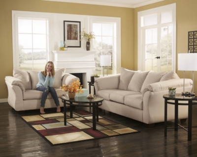 Talk about fine lines and great curves. That’s the beauty of the Darcy sofa—made to suit your appreciation for clean, contemporary style. A striking flared frame, comfy pillow top armrests and an ultra-soft upholstery that holds up to everyday living complete this fashion statement.High-resiliency foam cushions wrapped in thick poly fiber | Polyester upholstery | Loose seat and attached back and armrest cushions | Exposed feet with faux wood finish | Corner-blocked frame | Excluded from promotional discounts and coupons