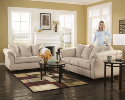 Talk about fine lines and great curves. That’s the beauty of the Darcy sofa—made to suit your appreciation for clean, contemporary style. A striking flared frame, comfy pillow top armrests and an ultra-soft upholstery that holds up to everyday living complete this fashion statement.High-resiliency foam cushions wrapped in thick poly fiber | Polyester upholstery | Loose seat and attached back and armrest cushions | Exposed feet with faux wood finish | Corner-blocked frame | Excluded from promotional discounts and coupons