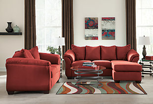 Talk about fine lines and great curves. That’s the beauty of the Darcy living room set—made to suit your appreciation for clean, contemporary style. A striking flared frame, comfy pillow top armrests and an ultra-soft upholstery that holds up to everyday living complete this fashion statement.Includes sofa chaise and loveseat  | Corner-blocked frame | Loose seat and attached back and armrest cushions | High-resiliency foam cushions wrapped in thick poly fiber | Polyester upholstery | Chaise can be positioned on either side (thanks to reversible seat cushion and movable ottoman) | Exposed feet with faux wood finish