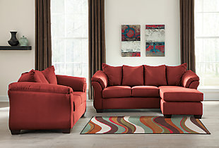 Talk about fine lines and great curves. That’s the beauty of the Darcy living room set—made to suit your appreciation for clean, contemporary style. A striking flared frame, comfy pillow top armrests and an ultra-soft upholstery that holds up to everyday living complete this fashion statement.Includes sofa chaise and loveseat  | Corner-blocked frame | Loose seat and attached back and armrest cushions | High-resiliency foam cushions wrapped in thick poly fiber | Polyester upholstery | Chaise can be positioned on either side (thanks to reversible seat cushion and movable ottoman) | Exposed feet with faux wood finish