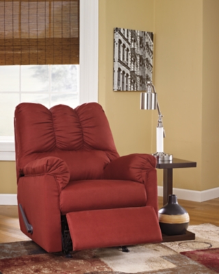 Talk about fine lines and great curves. That’s the beauty of the Darcy rocker recliner—made to suit your appreciation for clean, contemporary style. Comfy pillow top armrests, designer tailoring and an ultra-soft upholstery that holds up to everyday living complete this fashion statement.Attached back, seat and armrest cushions | Gentle rocking motion | High-resiliency foam cushions wrapped in thick poly fiber | Polyester upholstery | One-pull reclining motion | Corner-blocked frame with metal reinforced seat | Excluded from promotional discounts and coupons