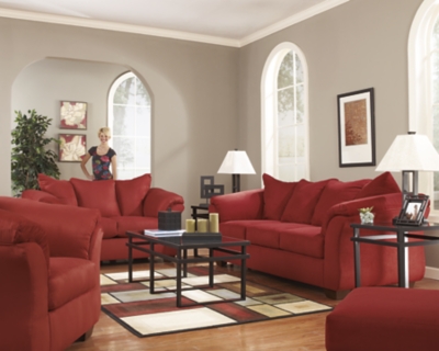 Talk about fine lines and great curves. That’s the beauty of the Darcy sofa—made to suit your appreciation for clean, contemporary style. A striking flared frame, comfy pillow top armrests and an ultra-soft upholstery that holds up to everyday living complete this fashion statement.Loose seat and attached back and armrest cushions | High-resiliency foam cushions wrapped in thick poly fiber | Polyester upholstery | Exposed feet with faux wood finish | Corner-blocked frame | Excluded from promotional discounts and coupons