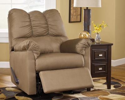 Talk about fine lines and great curves. That’s the beauty of the Darcy rocker recliner—made to suit your appreciation for clean, contemporary style. Comfy pillow top armrests, designer tailoring and an ultra-soft upholstery that holds up to everyday living complete this fashion statement.Attached back, seat and armrest cushions | Gentle rocking motion | High-resiliency foam cushions wrapped in thick poly fiber | Polyester upholstery | One-pull reclining motion | Corner-blocked frame with metal reinforced seat | Excluded from promotional discounts and coupons