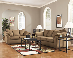 Talk about fine lines and great curves. That’s the beauty of the Darcy full sofa sleeper—made to suit your appreciation for clean, contemporary style. A striking flared frame, comfy pillow top armrests and an ultra-soft upholstery that holds up to everyday living complete this fashion statement. A pull-out full mattress means you’re fully prepared for overnight guests.Loose seat and attached back and armrest cushions | High-resiliency foam cushions wrapped in thick poly fiber | Polyester upholstery | Included bi-fold full memory foam mattress sits atop a supportive metal frame | Exposed feet with faux wood finish | Corner-blocked frame | Excluded from promotional discounts and coupons