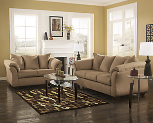 Talk about fine lines and great curves. That’s the beauty of the Darcy loveseat—made to suit your appreciation for clean, contemporary style. A striking flared frame, comfy pillow topped armrests and an ultra-soft upholstery that holds up to everyday living complete this fashion statement.Loose seat and attached back and armrest cushions | High-resiliency foam cushions wrapped in thick poly fiber | Polyester upholstery | Exposed feet with faux wood finish | Corner-blocked frame | Excluded from promotional discounts and coupons