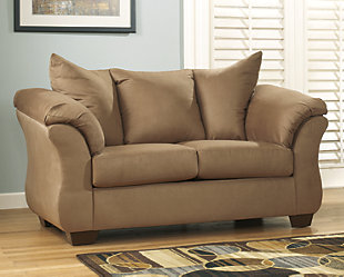 Talk about fine lines and great curves. That’s the beauty of the Darcy loveseat—made to suit your appreciation for clean, contemporary style. A striking flared frame, comfy pillow topped armrests and an ultra-soft upholstery that holds up to everyday living complete this fashion statement.Loose seat and attached back and armrest cushions | High-resiliency foam cushions wrapped in thick poly fiber | Polyester upholstery | Exposed feet with faux wood finish | Corner-blocked frame | Excluded from promotional discounts and coupons