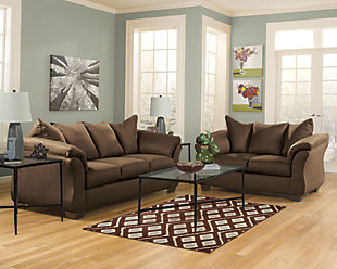 Talk about fine lines and great curves. That’s the beauty of the Darcy sofa—made to suit your appreciation for clean, contemporary style. A striking flared frame, comfy pillow top armrests and an ultra-soft upholstery that holds up to everyday living complete this fashion statement.Loose seat and attached back and armrest cushions | High-resiliency foam cushions wrapped in thick poly fiber | Polyester upholstery | Exposed feet with faux wood finish | Corner-blocked frame | Excluded from promotional discounts and coupons