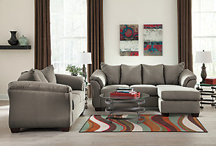 Talk about fine lines and great curves. That’s the beauty of the Darcy sofa chaise—made to suit your appreciation for clean, contemporary style. A stri flared frame, comfy pillow top armrests and an ultra-soft upholstery that holds up to everyday living complete this fashion statement. Versatile chaise has a movable ottoman and reversible cushion and can be used on right or left side.Corner-blocked frame | Loose seat and attached back and armrest cushions | High-resiliency foam cushions wrapped in thick poly fiber | Polyester upholstery | Exposed feet with faux wood finish | Chaise can be positioned on either side (thanks to reversible seat cushion and movable ottoman) | Excluded from promotional discounts and coupons