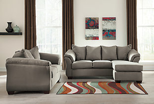 Talk about fine lines and great curves. That’s the beauty of the Darcy sofa chaise and loveseat package, which is made to suit your appreciation for clean, contemporary style. A striking flared frame, comfy pillow top armrests and ultra-soft upholstery that holds up to everyday living complete this fashion statement. The versatile chaise has a movable ottoman and reversible cushion, allowing this set to suit your living space with ease.Includes sofa chaise and loveseat | Corner-blocked frame | Loose seat and attached back and armrest cushions | High-resiliency foam cushions wrapped in thick poly fiber | Polyester upholstery | Exposed feet with faux wood finish | Chaise can be positioned on either side (thanks to reversible seat cushion and movable ottoman) | Assembly required