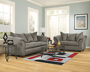 Talk about fine lines and great curves. That’s the beauty of the Darcy sofa—made to suit your appreciation for clean, contemporary style. A striking flared frame, comfy pillow top armrests and an ultra-soft upholstery that holds up to everyday living complete this fashion statement.High-resiliency foam cushions wrapped in thick poly fiber | Polyester upholstery | Loose seat and attached back and armrest cushions | Exposed feet with faux wood finish | Corner-blocked frame | Excluded from promotional discounts and coupons
