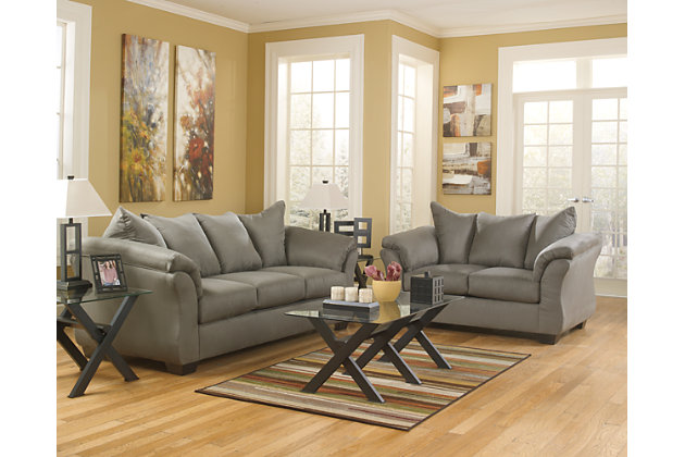 Talk about fine lines and great curves. That’s the beauty of the Darcy sofa and loveseat set—made to suit your appreciation for clean, contemporary style. Striking flared profiles, comfy pillow top armrests and an ultra-soft upholstery that holds up to everyday living complete this fashion statement.Smart Buys are our best everyday low price and excluded from promotional discounts and coupons | Includes sofa and loveseat | Corner-blocked frames | Attached back and loose seat cushions | High-resiliency foam cushions wrapped in thick poly fiber | Polyester upholstery | Exposed feet with faux wood finish