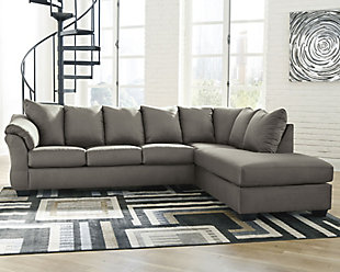 Talk about fine lines and great curves. That’s the beauty of the Darcy sectional—made to suit your appreciation for clean, contemporary style. A striking flared frame, comfy pillow top armrests and an ultra-soft upholstery that holds up to everyday living complete this fashion statement.Includes 2 pieces: right-arm facing corner chaise and left-arm facing sofa | "Left-arm" and "right-arm" describe the position of the arm when you face the piece | Corner-blocked frame | Attached back and loose seat cushions | High-resiliency foam cushions wrapped in thick poly fiber | Polyester upholstery | Exposed feet with faux wood finish | Includes 2 pieces: right-arm facing corner chaise and left-arm facing sofa | Estimated Assembly Time: 5 Minutes