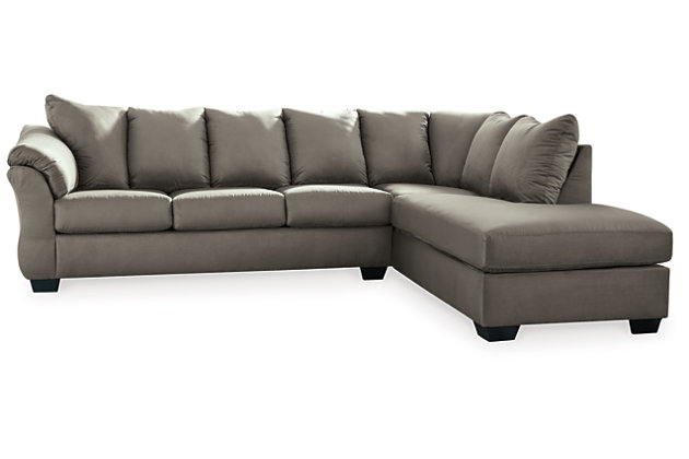 Talk about fine lines and great curves. That’s the beauty of the Darcy sectional—made to suit your appreciation for clean, contemporary style. A striking flared frame, comfy pillow top armrests and an ultra-soft upholstery that holds up to everyday living complete this fashion statement.Left-arm and "right-arm" describes the position of the arm when you face the piece | Corner-blocked frame | Attached back and loose seat cushions | High-resiliency foam cushions wrapped in thick poly fiber | Polyester upholstery | Exposed feet with faux wood finish | Estimated Assembly Time: 5 Minutes