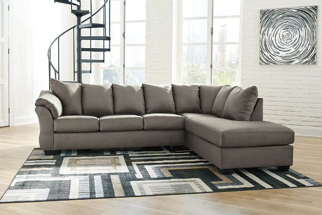 Talk about fine lines and great curves. That’s the beauty of the Darcy sectional—made to suit your appreciation for clean, contemporary style. A striking flared frame, comfy pillow top armrests and an ultra-soft upholstery that holds up to everyday living complete this fashion statement.Includes 2 pieces: right-arm facing corner chaise and left-arm facing sofa | "Left-arm" and "right-arm" describe the position of the arm when you face the piece | Corner-blocked frame | Attached back and loose seat cushions | High-resiliency foam cushions wrapped in thick poly fiber | Polyester upholstery | Exposed feet with faux wood finish | Includes 2 pieces: right-arm facing corner chaise and left-arm facing sofa | Estimated Assembly Time: 5 Minutes