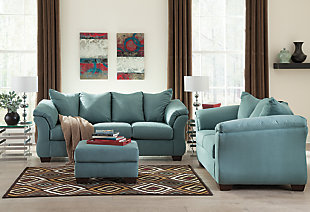 Talk about fine lines and great curves. That’s the beauty of the Darcy sofa—made to suit your appreciation for clean, contemporary style. A striking flared frame, comfy pillow top armrests and ultra-soft upholstery complete this fashion statement.High-resiliency foam cushions wrapped in thick poly fiber | Polyester upholstery | Loose seat and attached back and armrest cushions | Exposed feet with faux wood finish | Corner-blocked frame | Excluded from promotional discounts and coupons