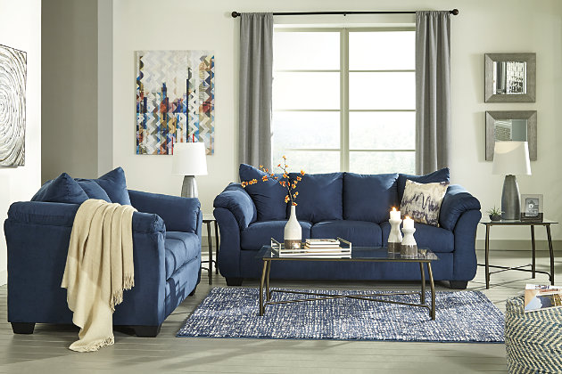 Talk about fine lines and great curves. That’s the beauty of the Darcy loveseat—made to suit your appreciation for clean, contemporary style. A striking flared frame, comfy pillow top armrests and an ultra-soft upholstery that holds up to everyday living complete this fashion statement.Corner-blocked frame | Loose seat and attached back and armrest cushions | High-resiliency foam cushions wrapped in thick poly fiber | Polyester upholstery | Exposed feet with faux wood finish | Excluded from promotional discounts and coupons
