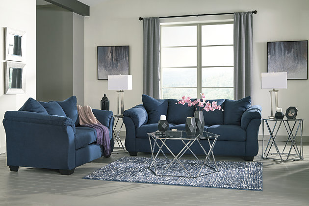 Talk about fine lines and great curves. That’s the beauty of the Darcy loveseat—made to suit your appreciation for clean, contemporary style. A striking flared frame, comfy pillow top armrests and an ultra-soft upholstery that holds up to everyday living complete this fashion statement.Corner-blocked frame | Loose seat and attached back and armrest cushions | High-resiliency foam cushions wrapped in thick poly fiber | Polyester upholstery | Exposed feet with faux wood finish | Excluded from promotional discounts and coupons