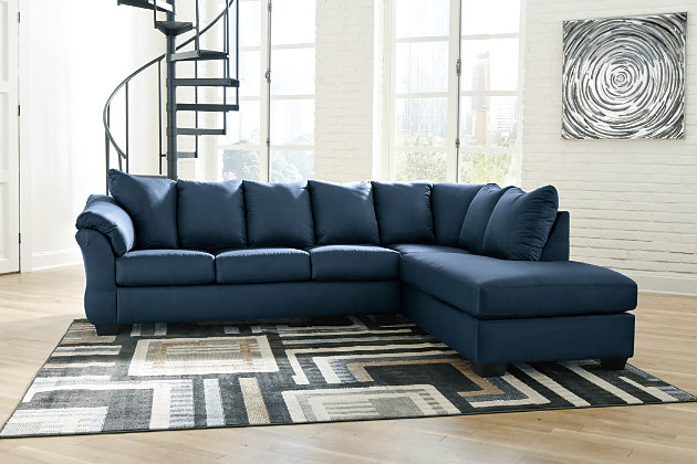 Talk about fine lines and great curves. That’s the beauty of the Darcy sectional—made to suit your appreciation for clean, contemporary style. A striking flared frame, comfy pillow top armrests and an ultra-soft upholstery that holds up to everyday living complete this fashion statement.Includes 2 pieces: right-arm facing corner chaise and left-arm facing sofa | Left-arm and "right-arm" describes the position of the arm when you face the piece | Corner-blocked frame | Attached back and loose seat cushions | High-resiliency foam cushions wrapped in thick poly fiber | Polyester upholstery | Exposed feet with faux wood finish | Estimated Assembly Time: 5 Minutes
